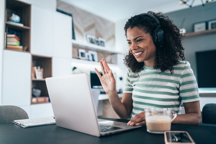 A woman attending a zoom meeting on her laptop