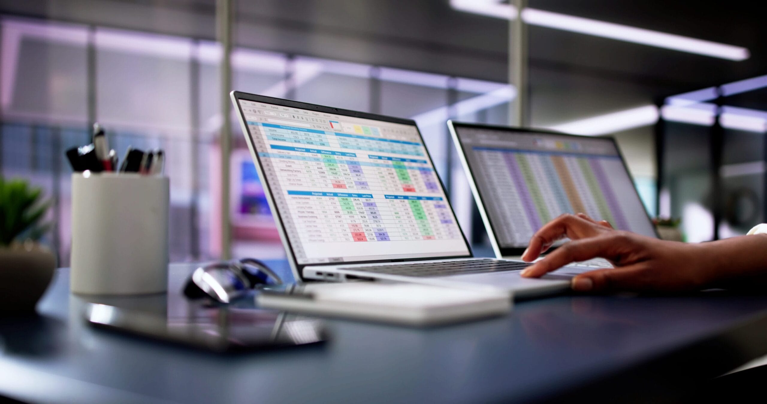 Close up of a laptop displaying various charts and graphs on screen