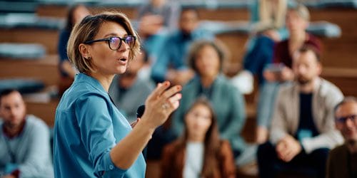 Woman speaking to a group of people